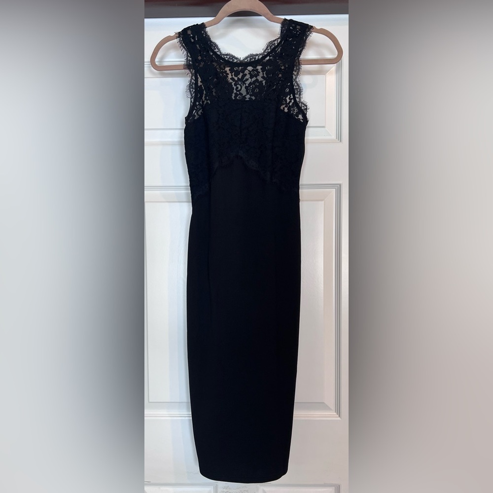Gorgeous cocktail dress, midi length with lace detail at the top. Only worn once